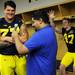 Michigan linebacker Jake Ryan photo bombs offensive linesman Taylor Lewan as he does an interview in the locker room during media day on Sunday, August 11, 2013. Melanie Maxwell | AnnArbor.com